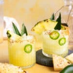 Two glasses of pineapple margarita cocktail.