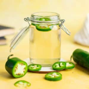 Jalapeno syrup in a jar.