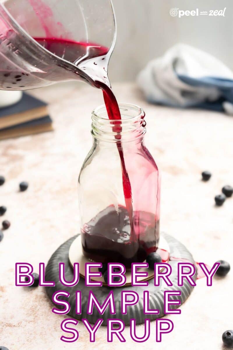 Blueberry syrup in a glass bottle.