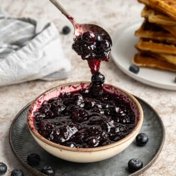 Blueberry syrup in a bowl.