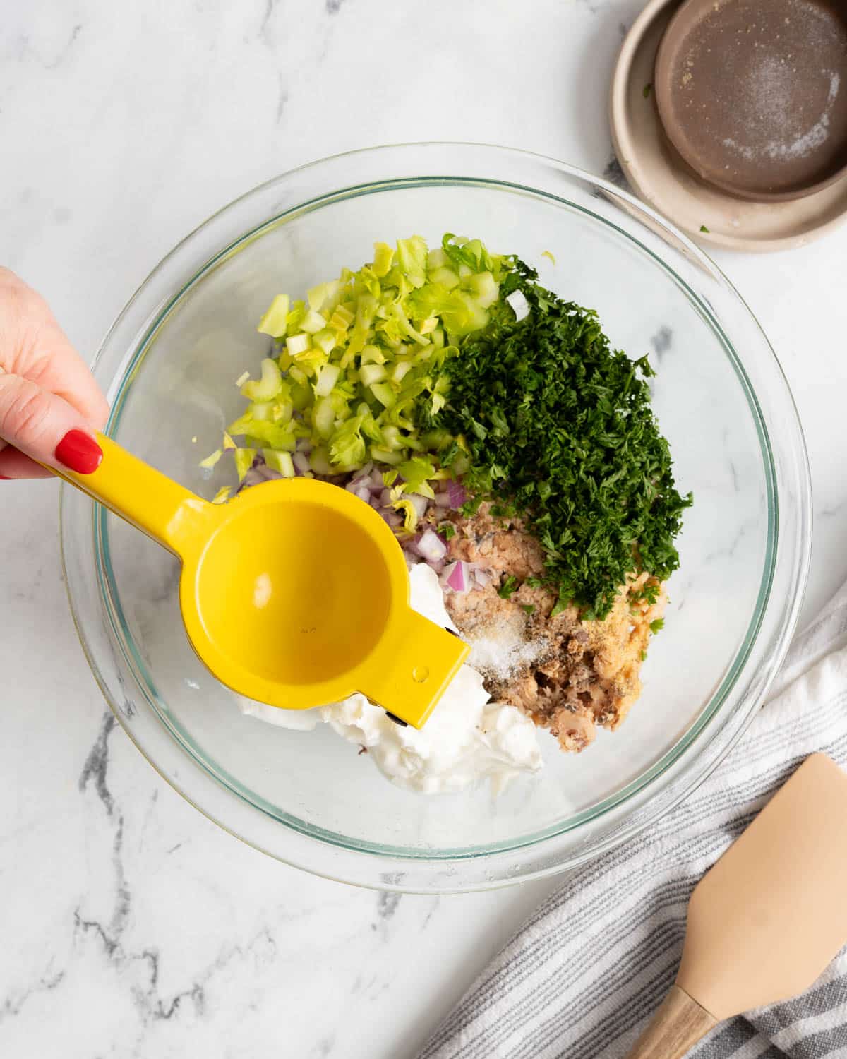 Salmon salad ingredients in a bowl.