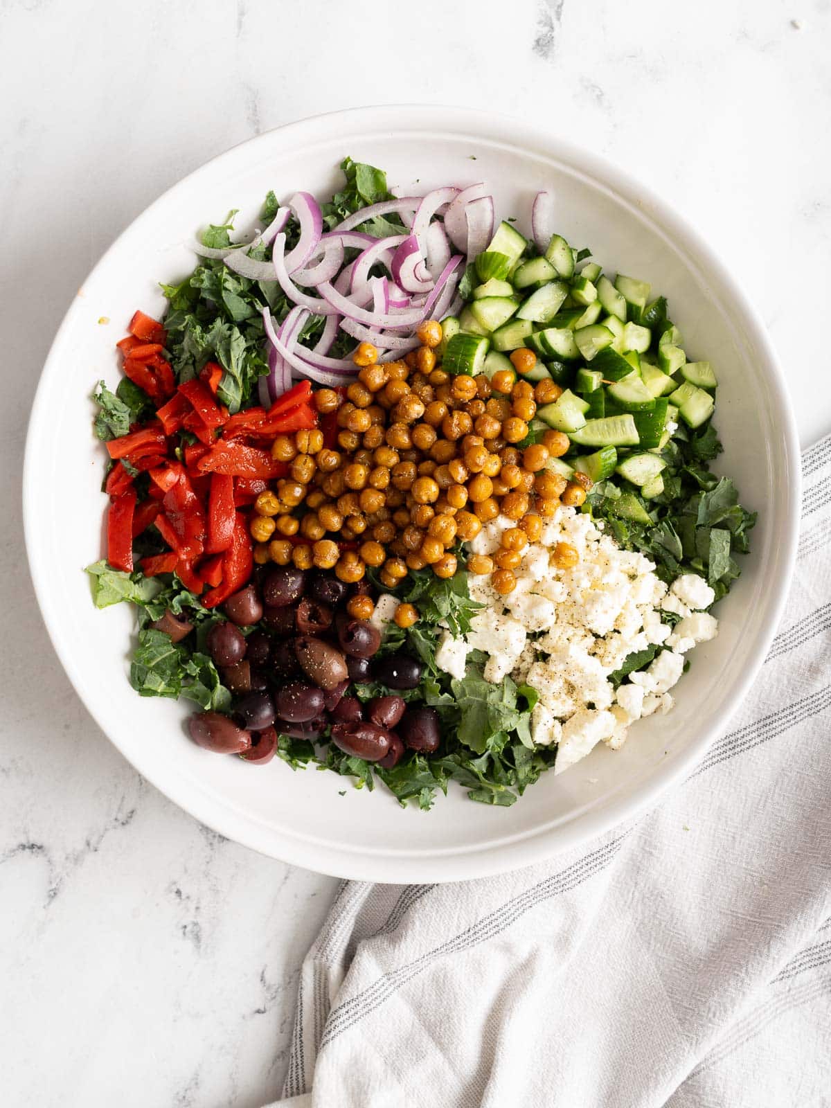Chickpea salad ingredients in a bowl.