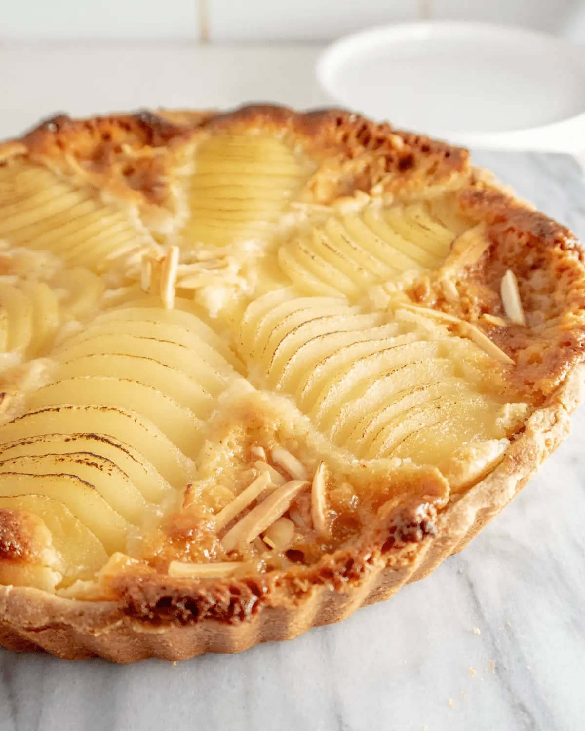 Pear pie on a serving plate.