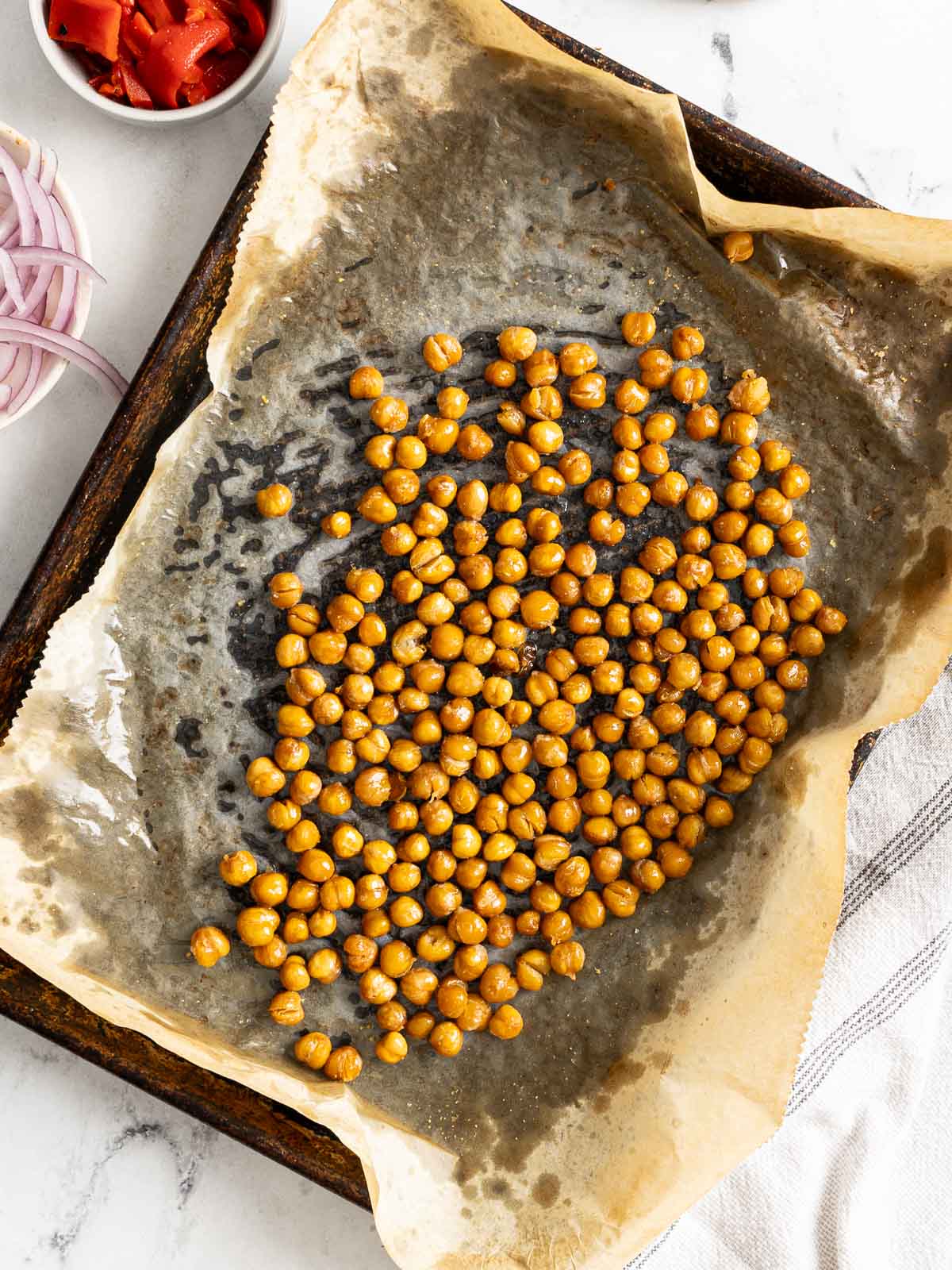 Roasted chickpeas in a sheet pan.