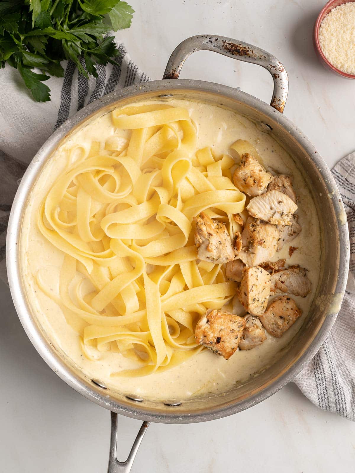 Chicken alfredo pasta in a pot.