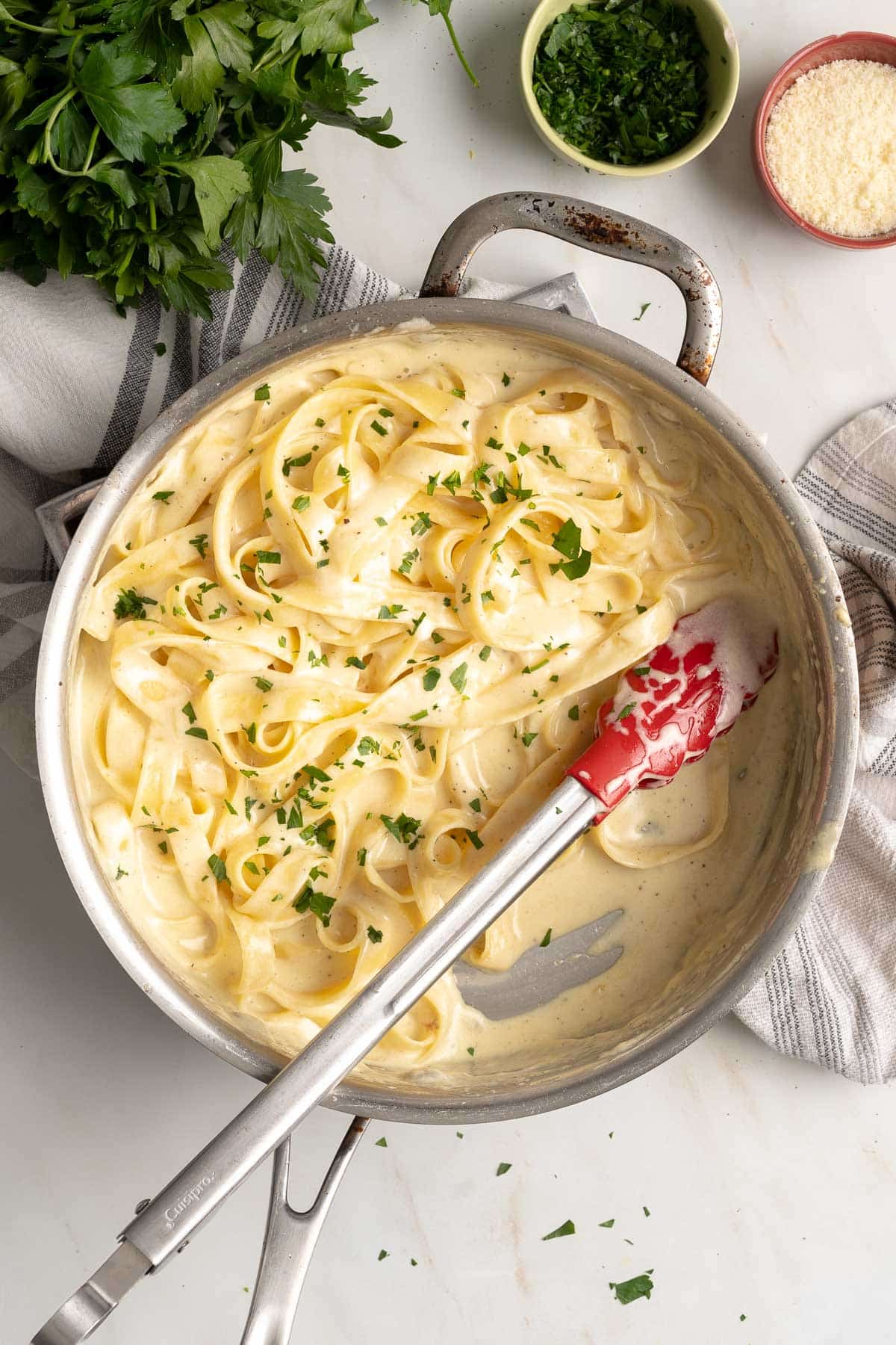 Gluten-free pasta with alfredo sauce in a pot.