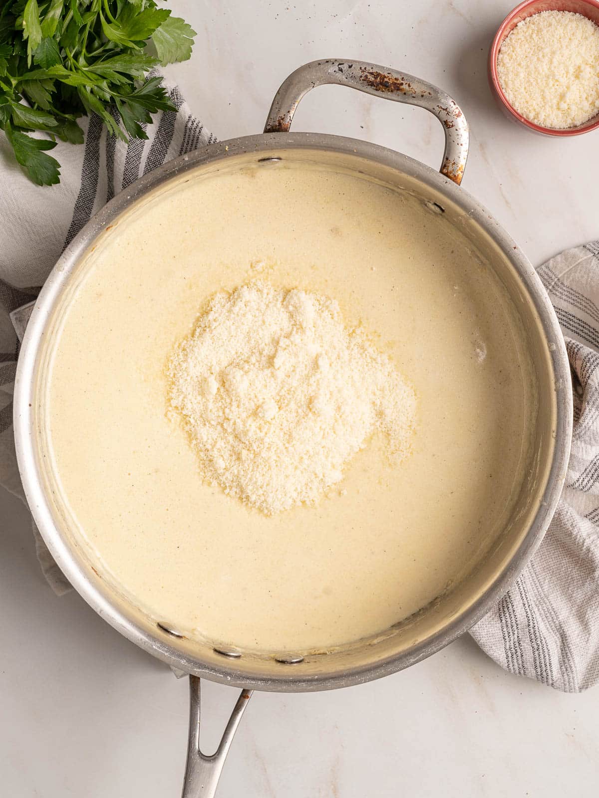 Alfredo sauce in a pot.