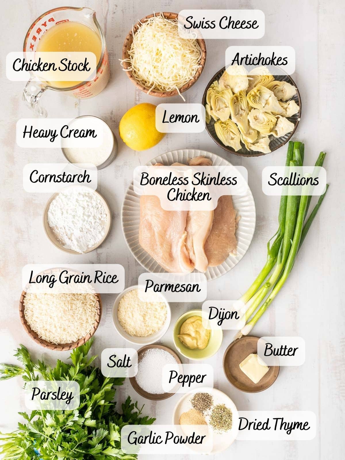 Ingredients for Artichoke Chicken Casserole displayed on a countertop.⁣