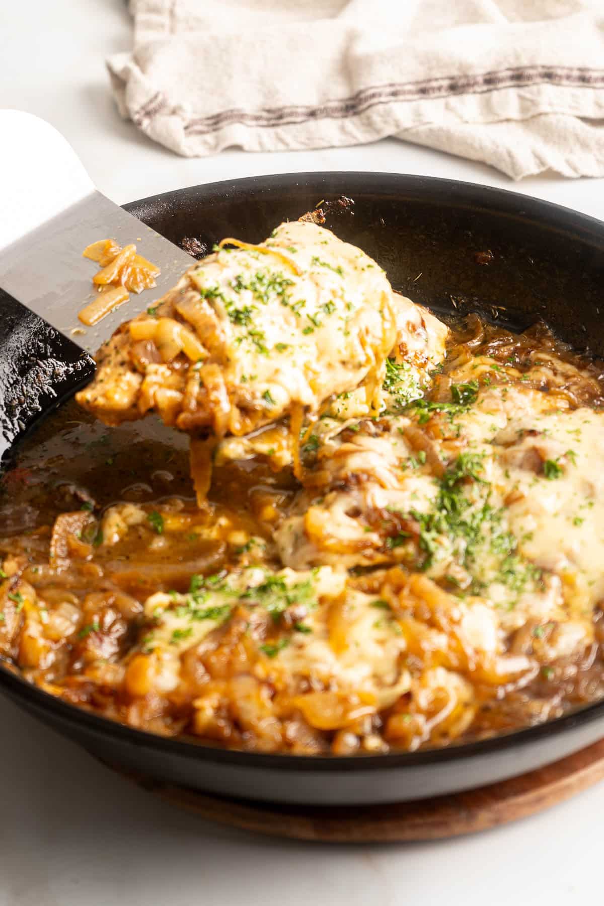 French onion chicken breast in a pan.