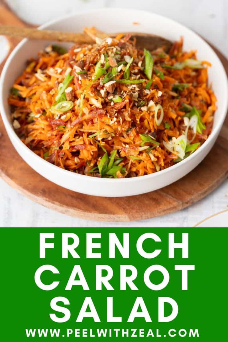 French carrot salad served in a bowl on a wooden tray.