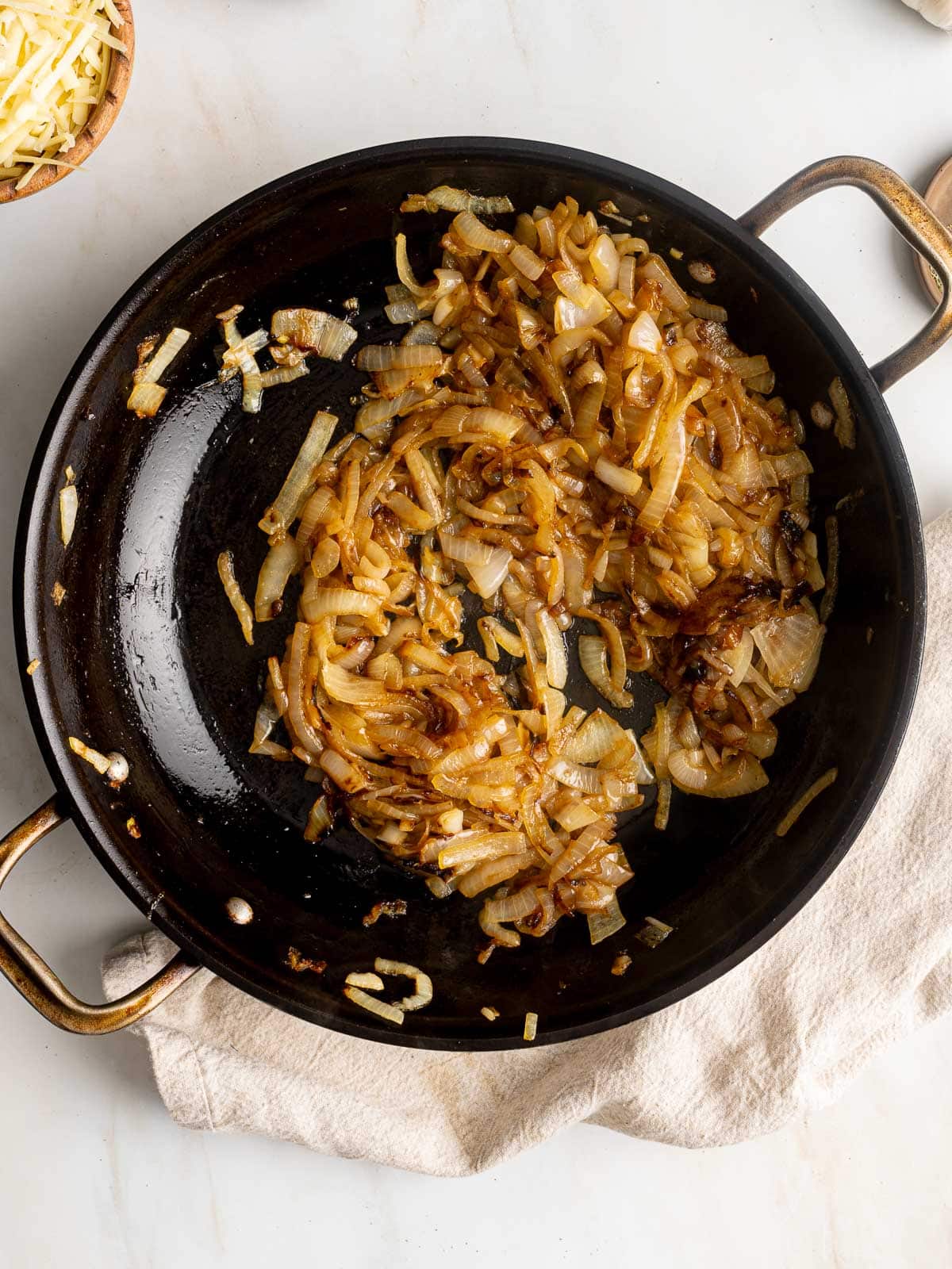 Sautéed onions in a pan.