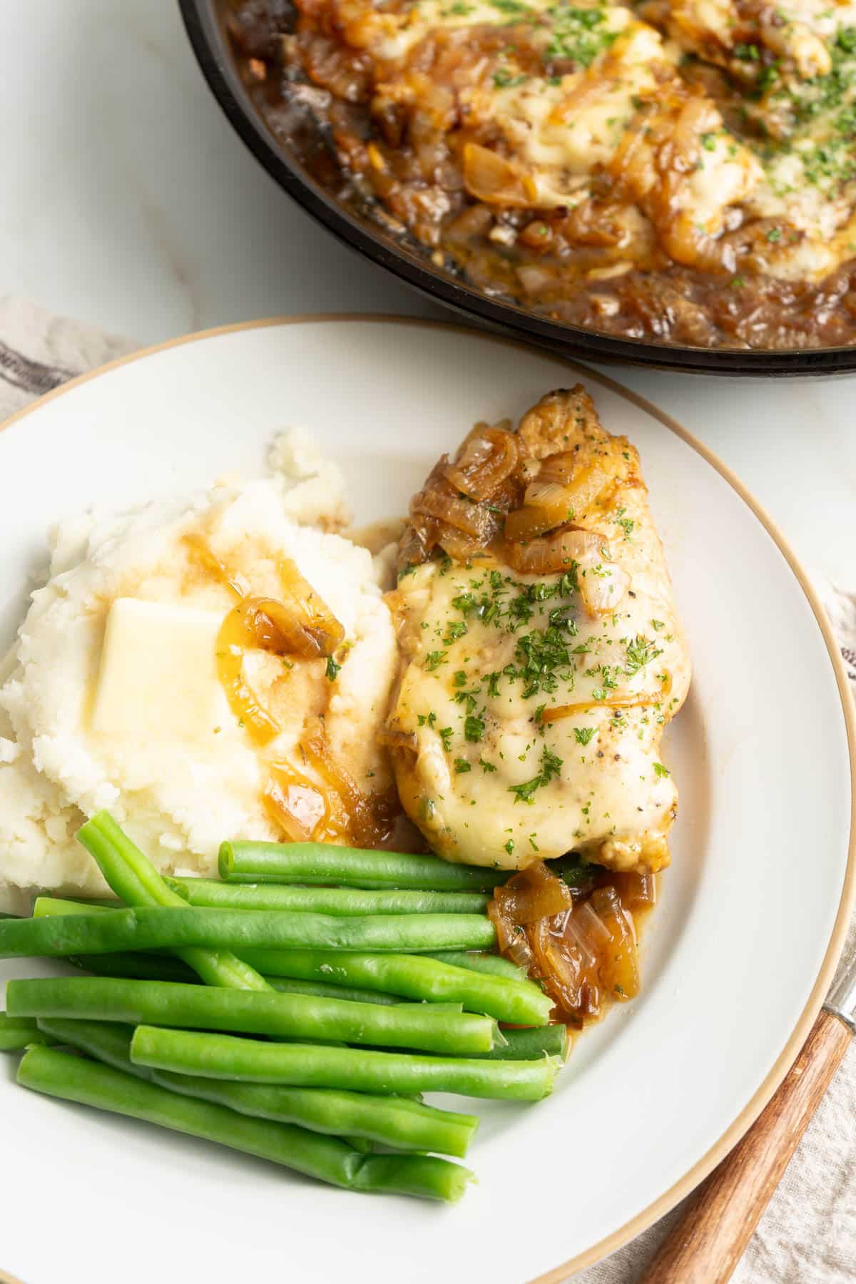 French onion chicken with green beans and mashed potatoes.