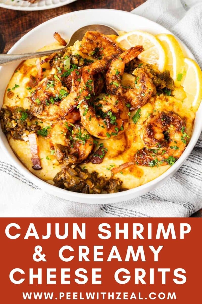 Cajun shrimp and grits served in a dish enrich with lemon slices.⁣⁣ ⁣⁣⁣⁣