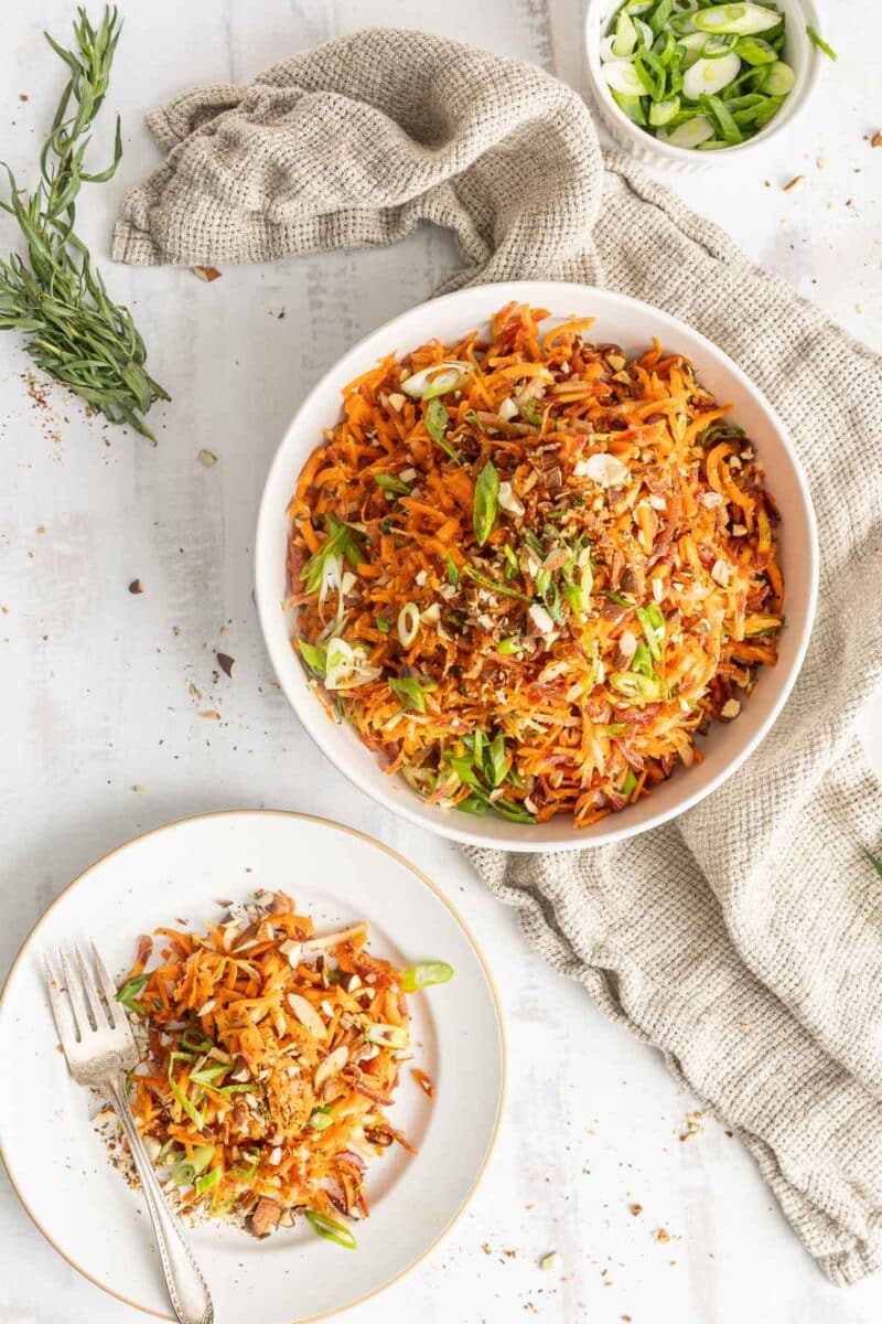 French carrot salad served in both a bowl and on a plate.