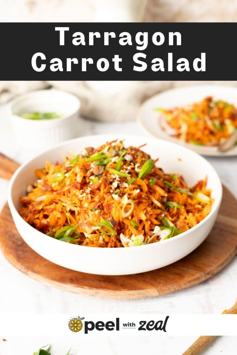 Tarragon Carrot salad presented in a bowl on a wooden tray.