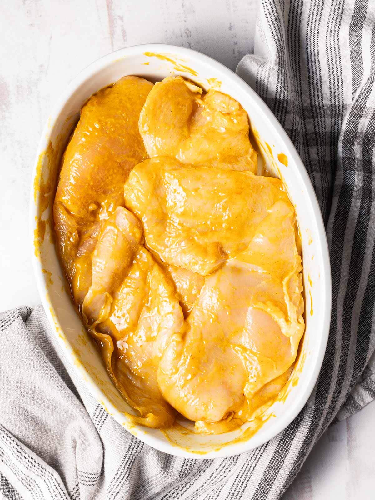 Carolina barbeque sauce serve on an oval shape dish.