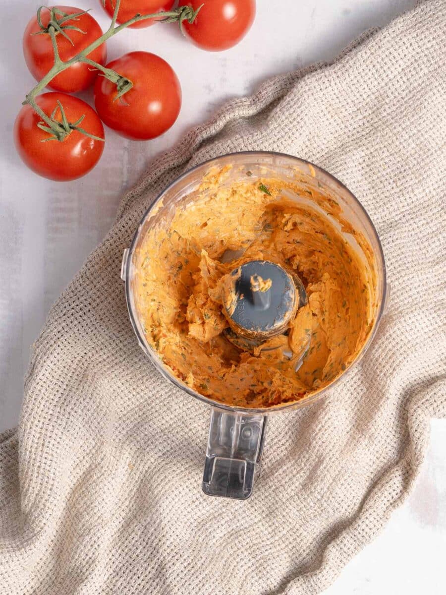 Tomato Butter in the blender resting on the table.