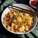 Shrimp chicken fried rice in a bowl serve on the table.