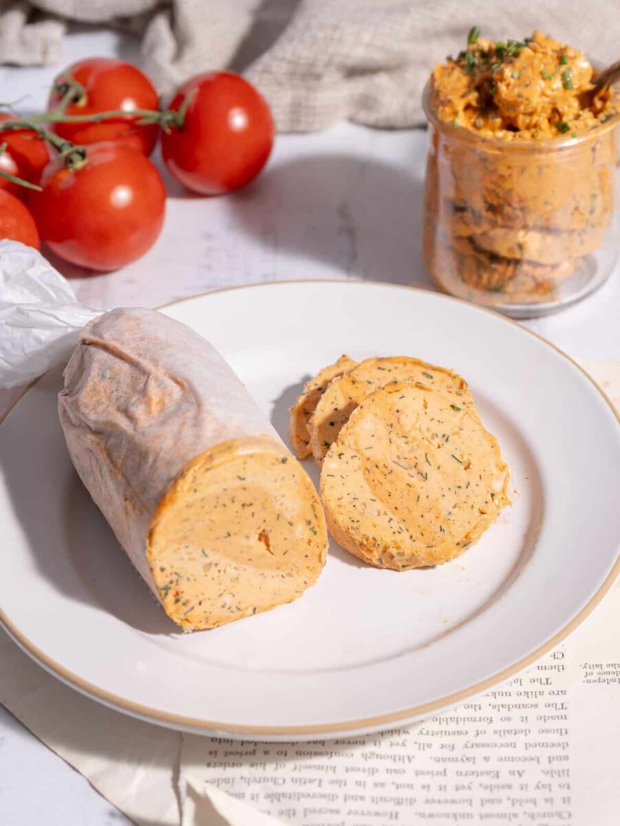 Tomato Butter in a glass and tomato butter wrap in a parchment paper.