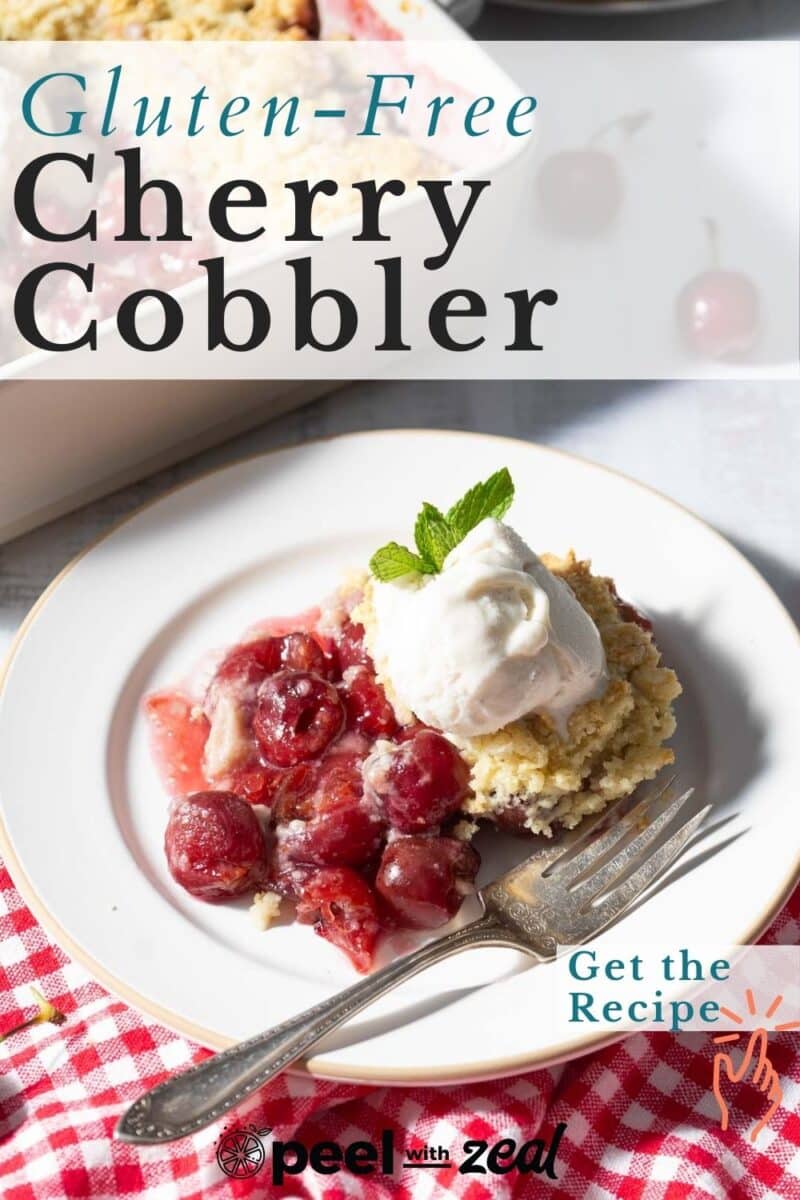 A plate of cherry cobbler topped with vanilla ice cream, is placed on the table.