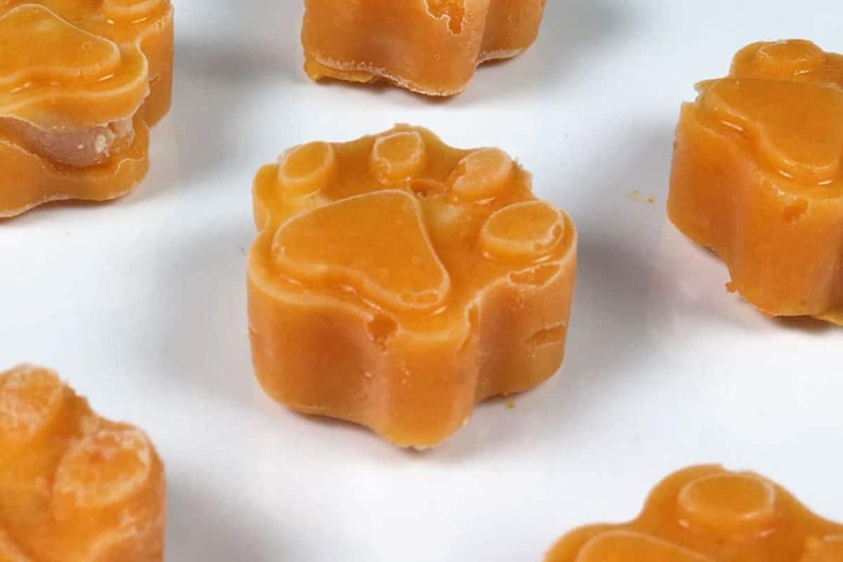 Golden Vegetable Frosty Paws with Tasty Meaty Middles in a white surface.