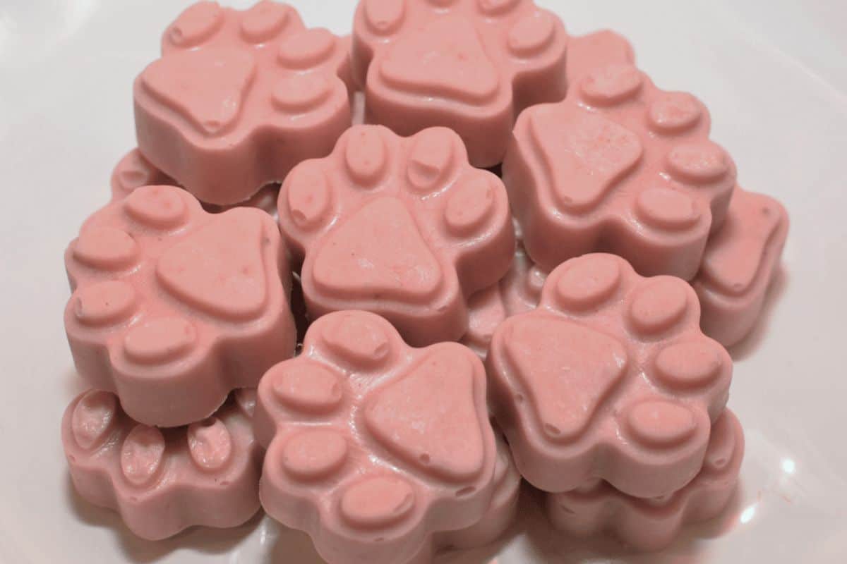 Easy No-Bake Frozen Strawberry Banana Dog Treats stack on a tray.