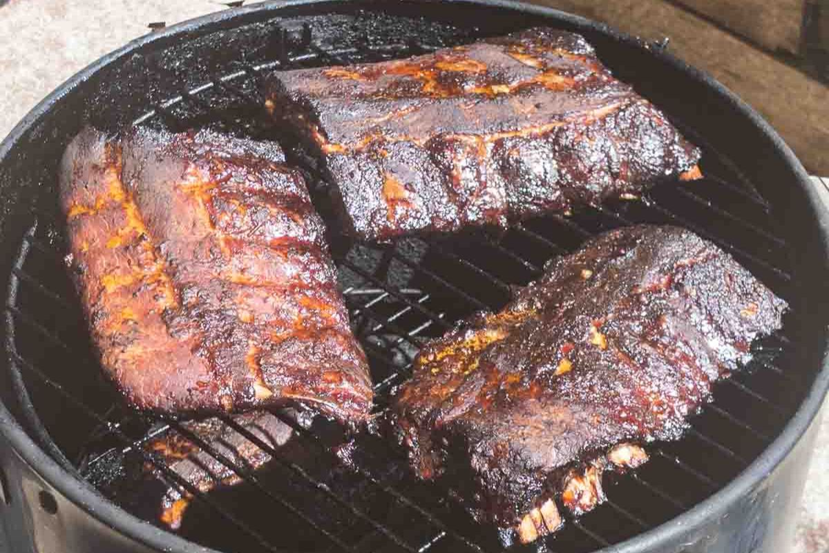 Baby back ribs on a smoker.