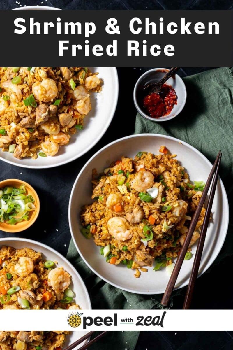 Shrimp and chicken fried rice served in a bowl, set on the table.