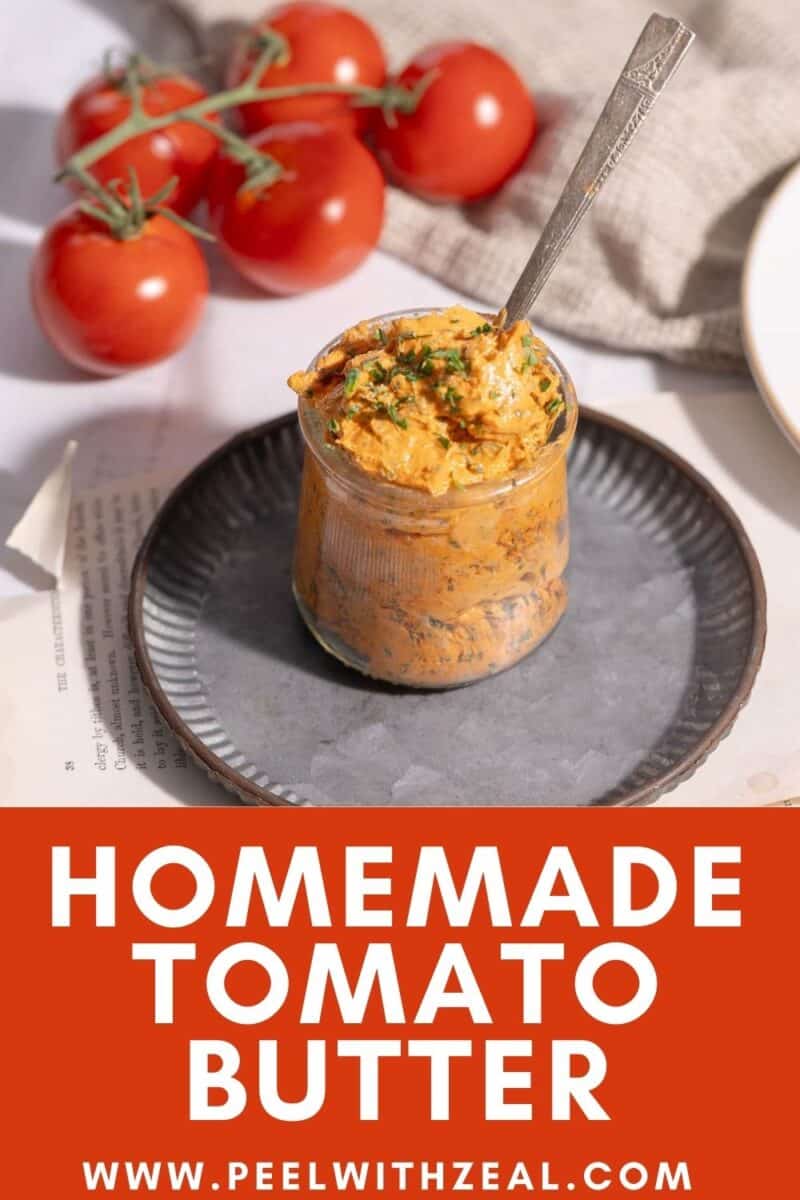 Homemade Tomato Butter in a glass sits on a platter atop the table.