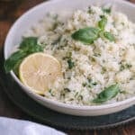 A close-up shot of Lemon basil rice served on a shallow platter resting on the table.