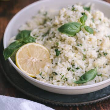 A close-up shot of Lemon basil rice served on a shallow platter resting on the table.