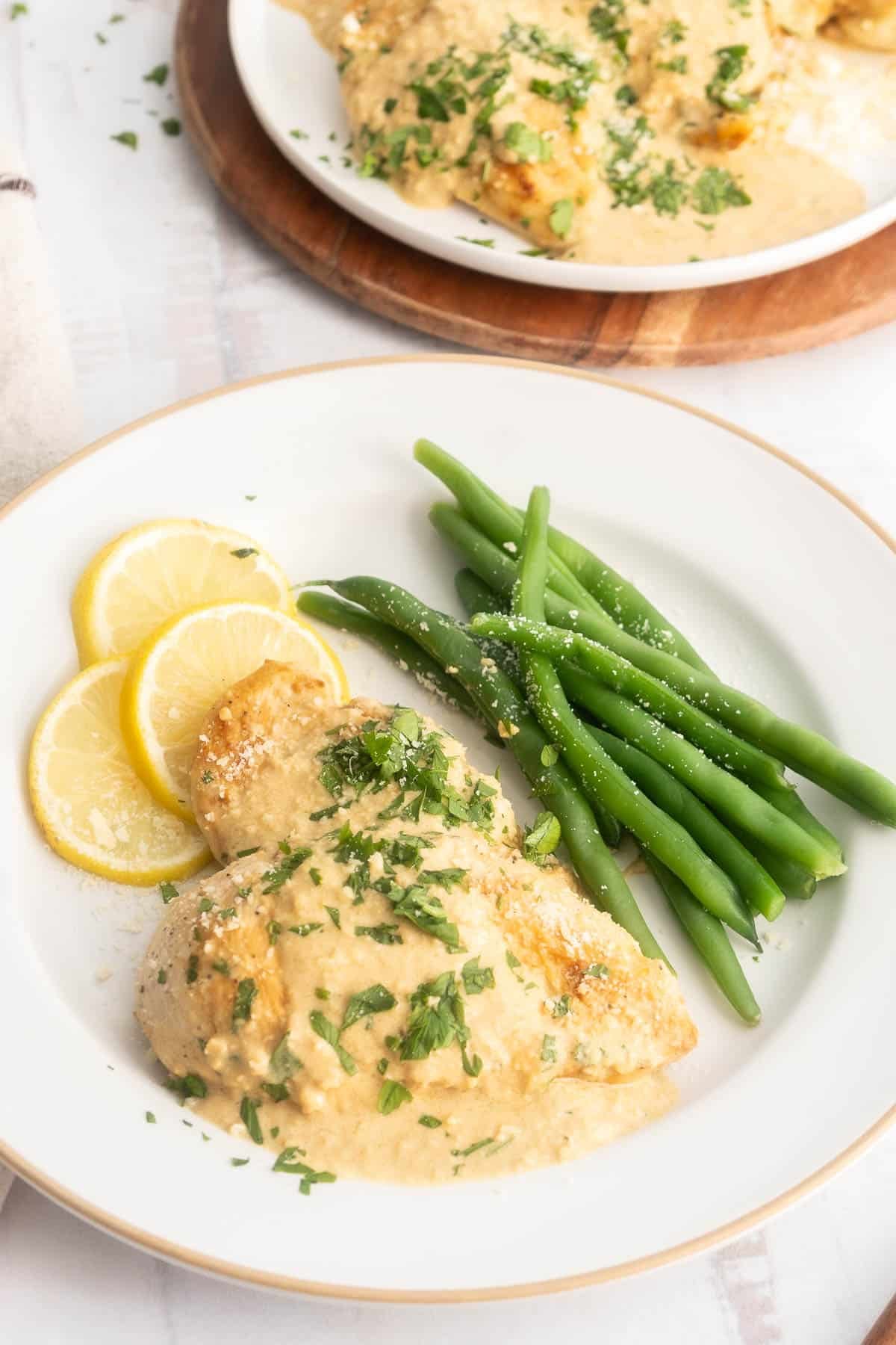 Creamy garlic parmesan chicken on a dinner plate.