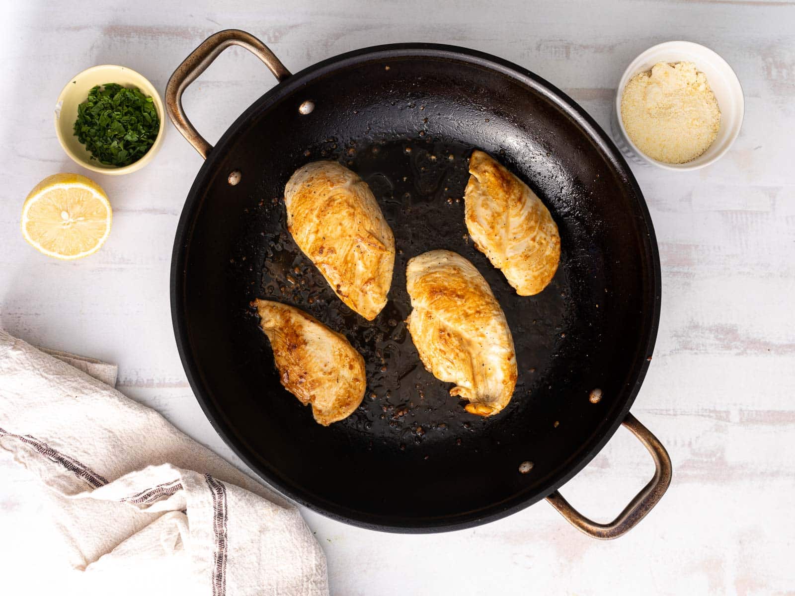 Showing Chicken breast fried in a wok.