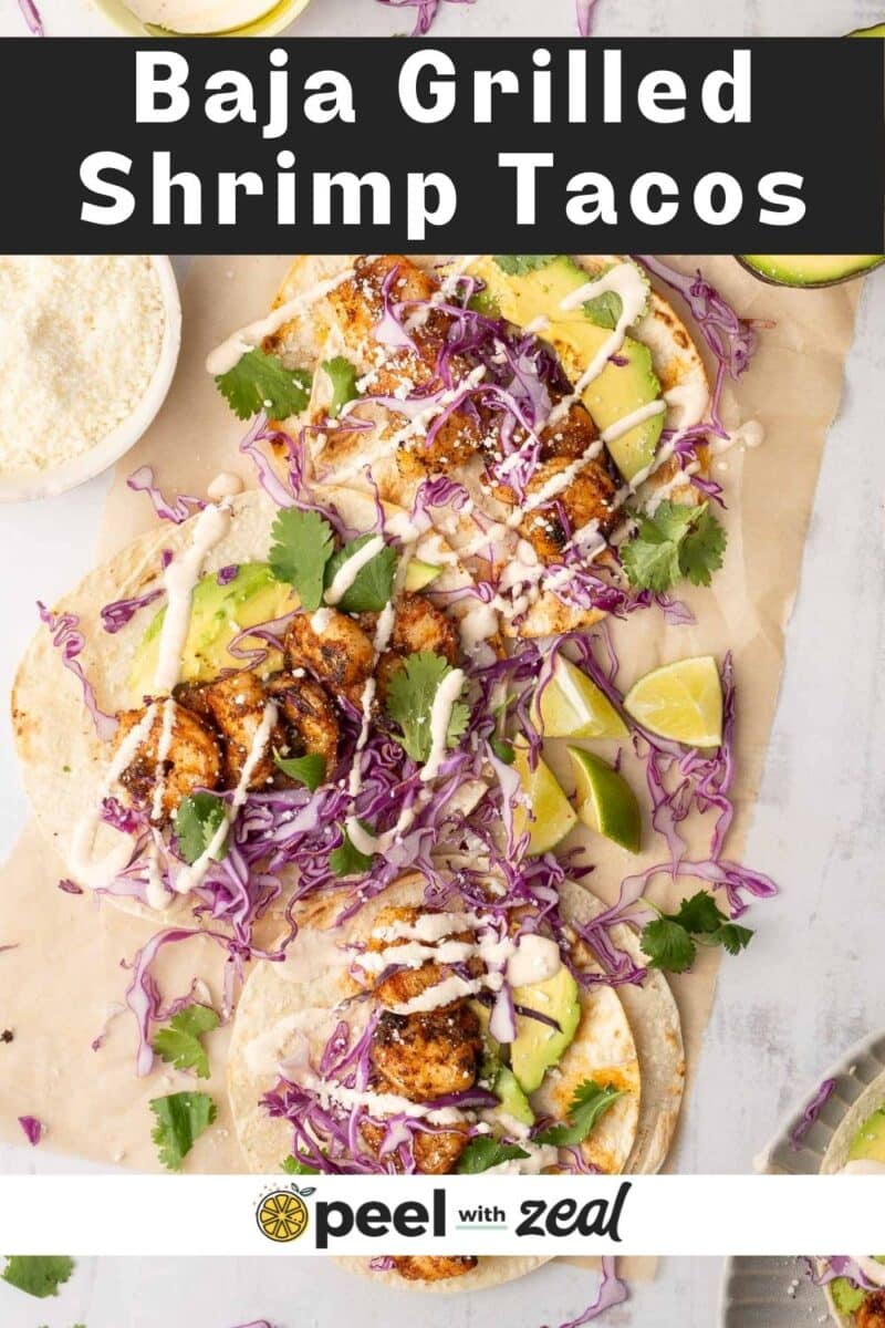 Shrimp Tacos drizzled with Baja sauce placed on the table.