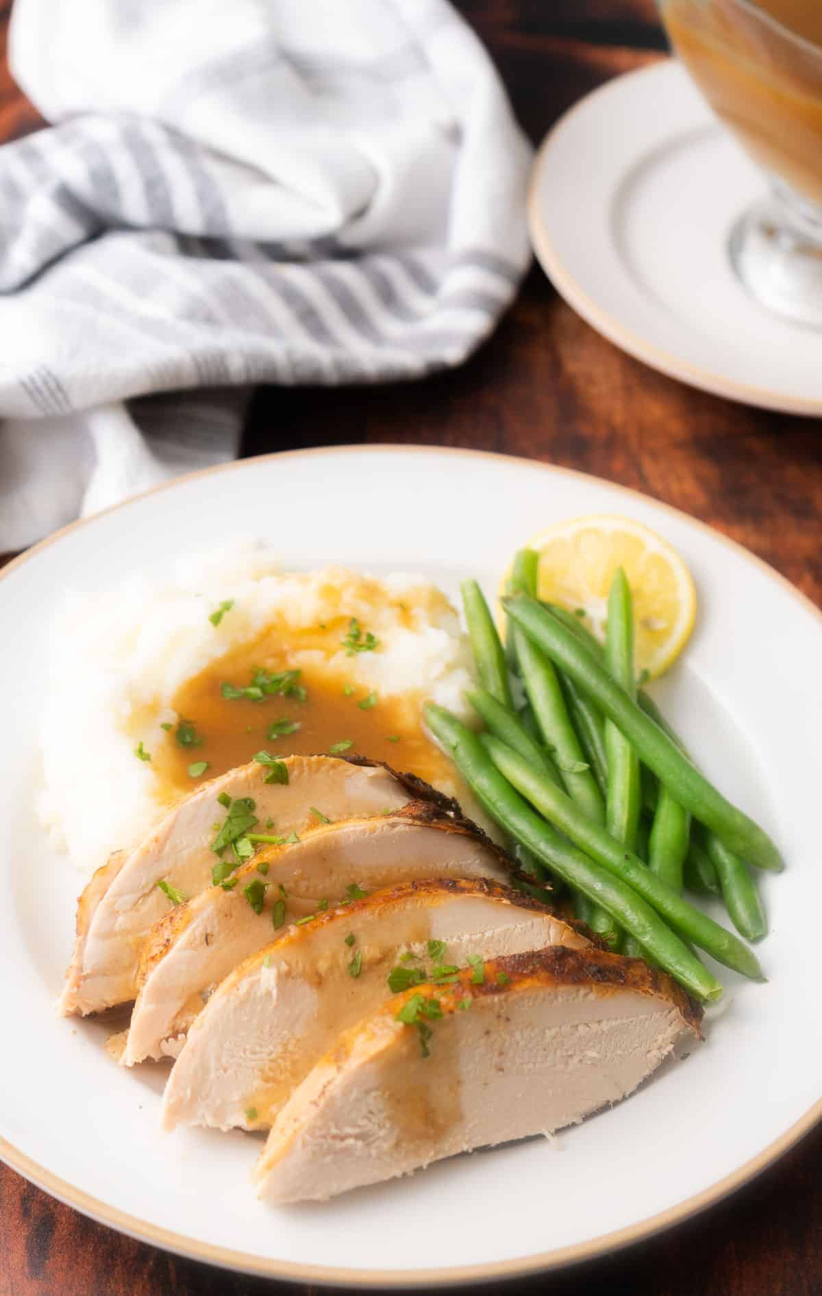 A slices of Cajun Turkey meat is being served on the dinner plate.