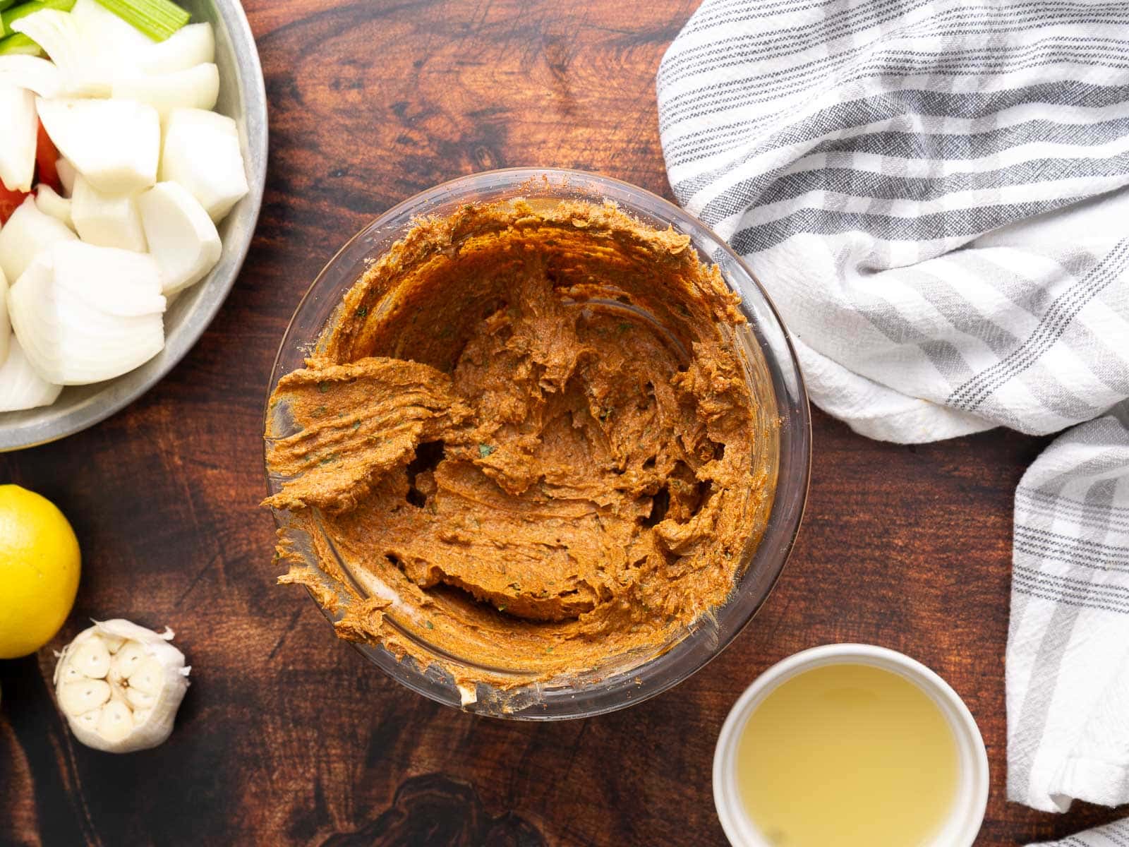 A Cajun mixture is being prepared on a bowl.