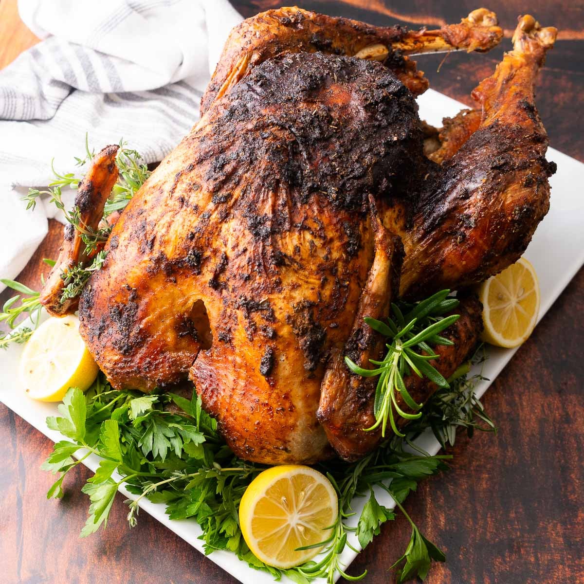 Roasted turkey on a serving plate.