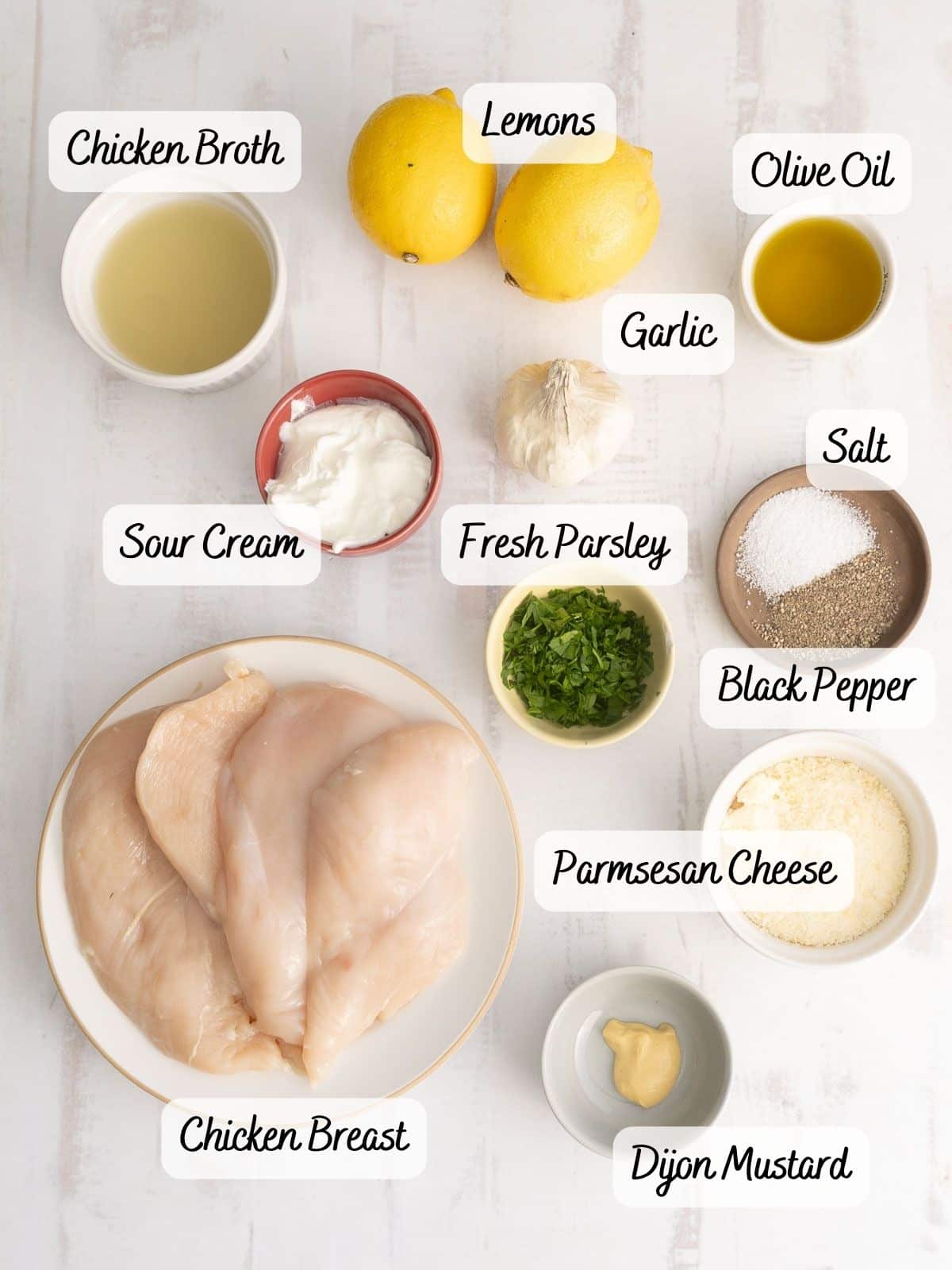 Ingredients of Creamy garlic parmesan chicken displayed on the countertop.