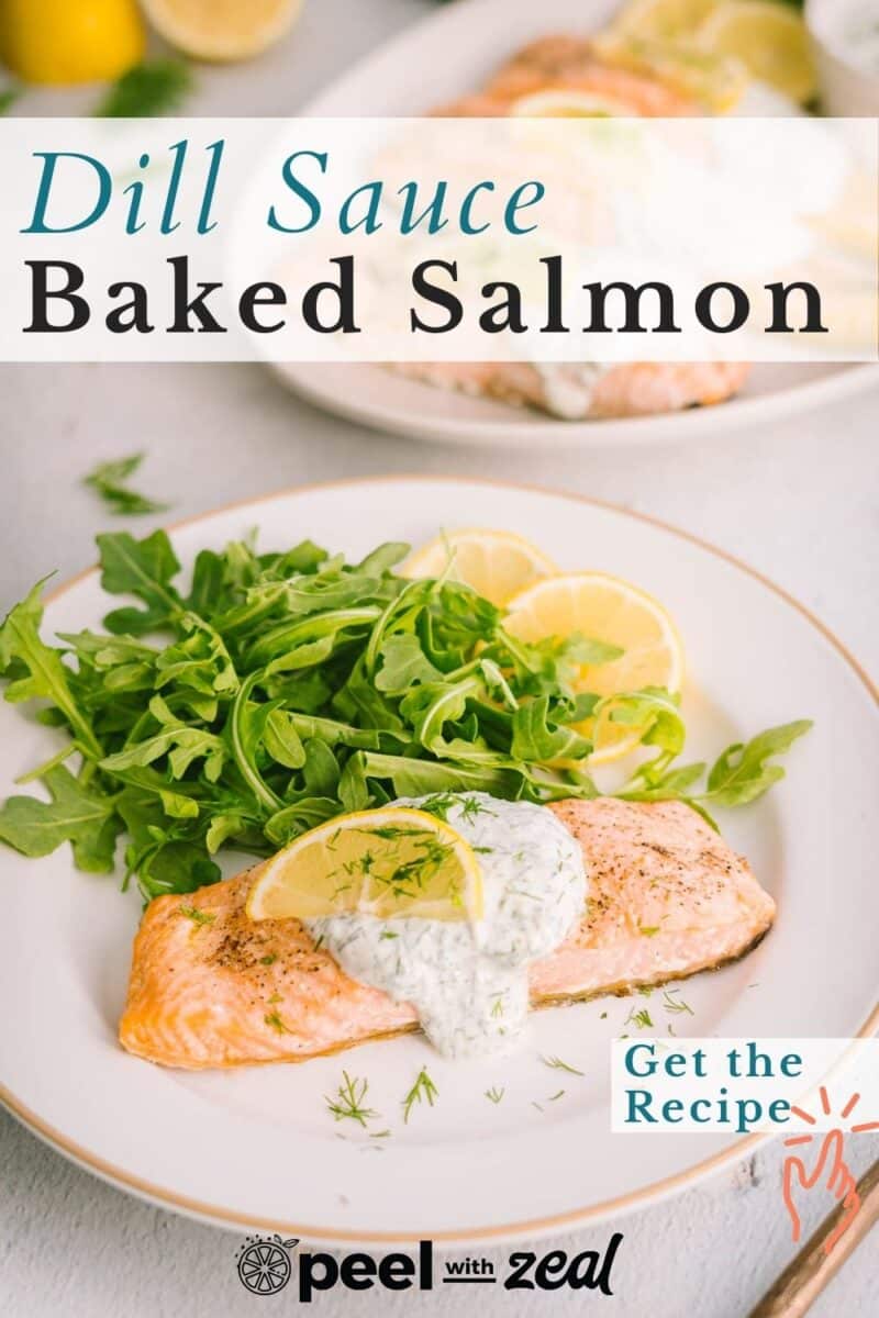 Salmon with yogurt with dill sauce garnished with lemon slices served on the dinner plate.
