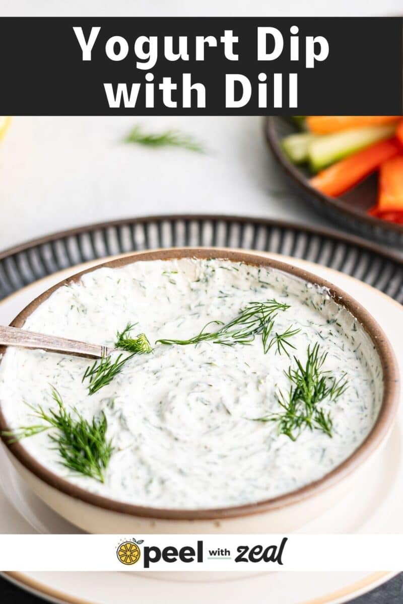 Greek yogurt dill sauce in small bowl place on the dinner plate served on the table.