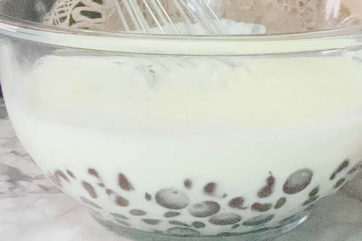 Whisking chocolate chips and cream filling in a mixing bowl