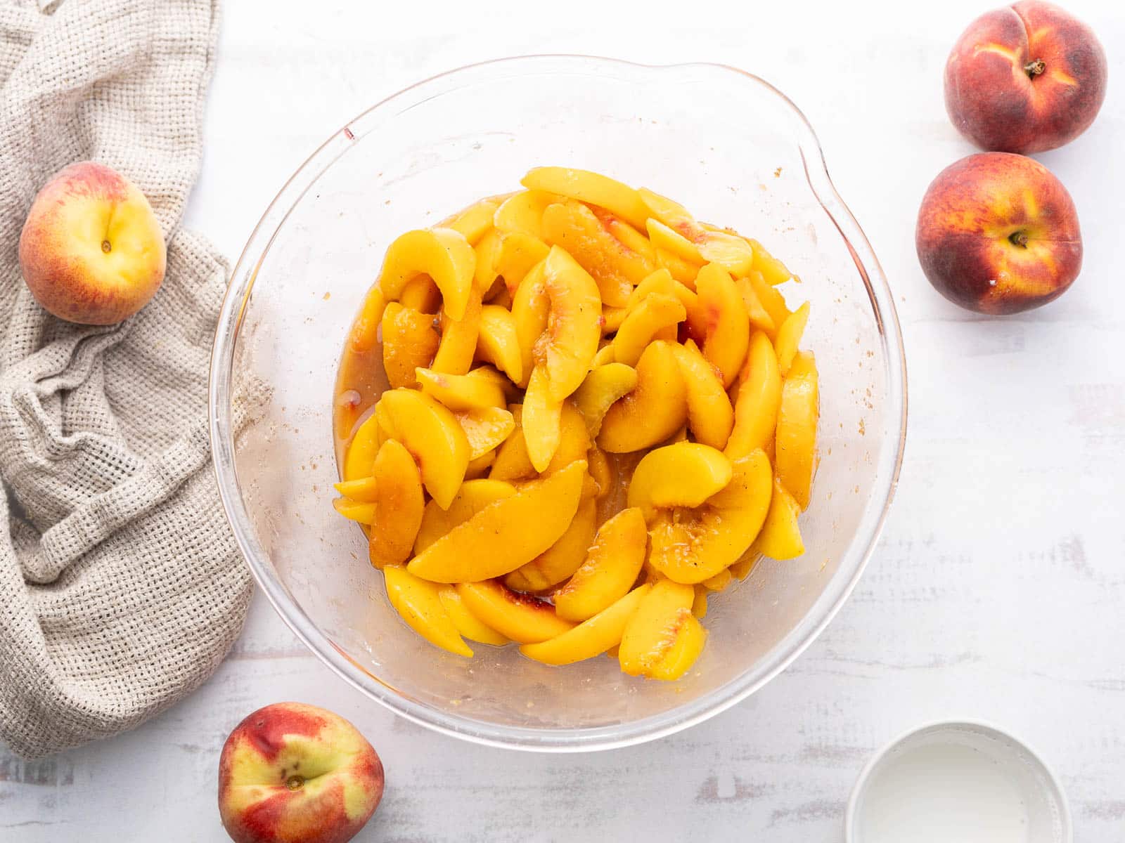 Slices of peaches in a mixing bowl.