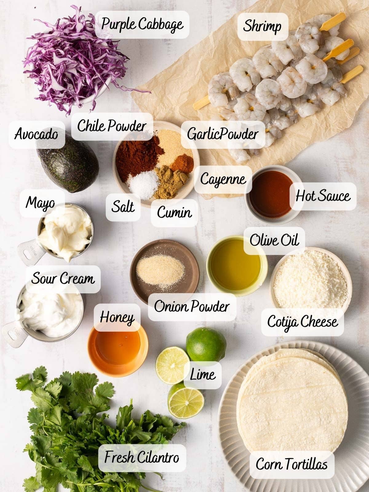 Showcasing the ingredients needed for Shrimp tacos being displayed on the table.