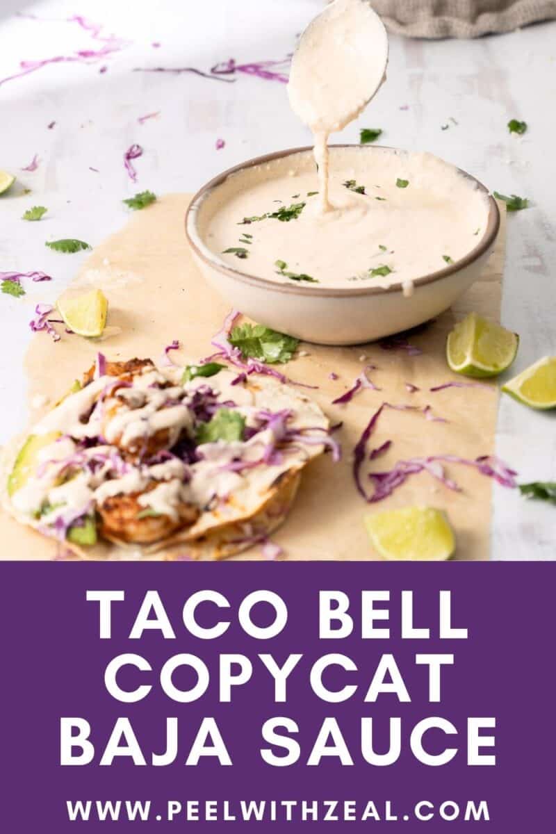 Taco Bell copycat Baja sauce in a bowl and a taco with shrimp drizzled with Baja sauce served on the table.