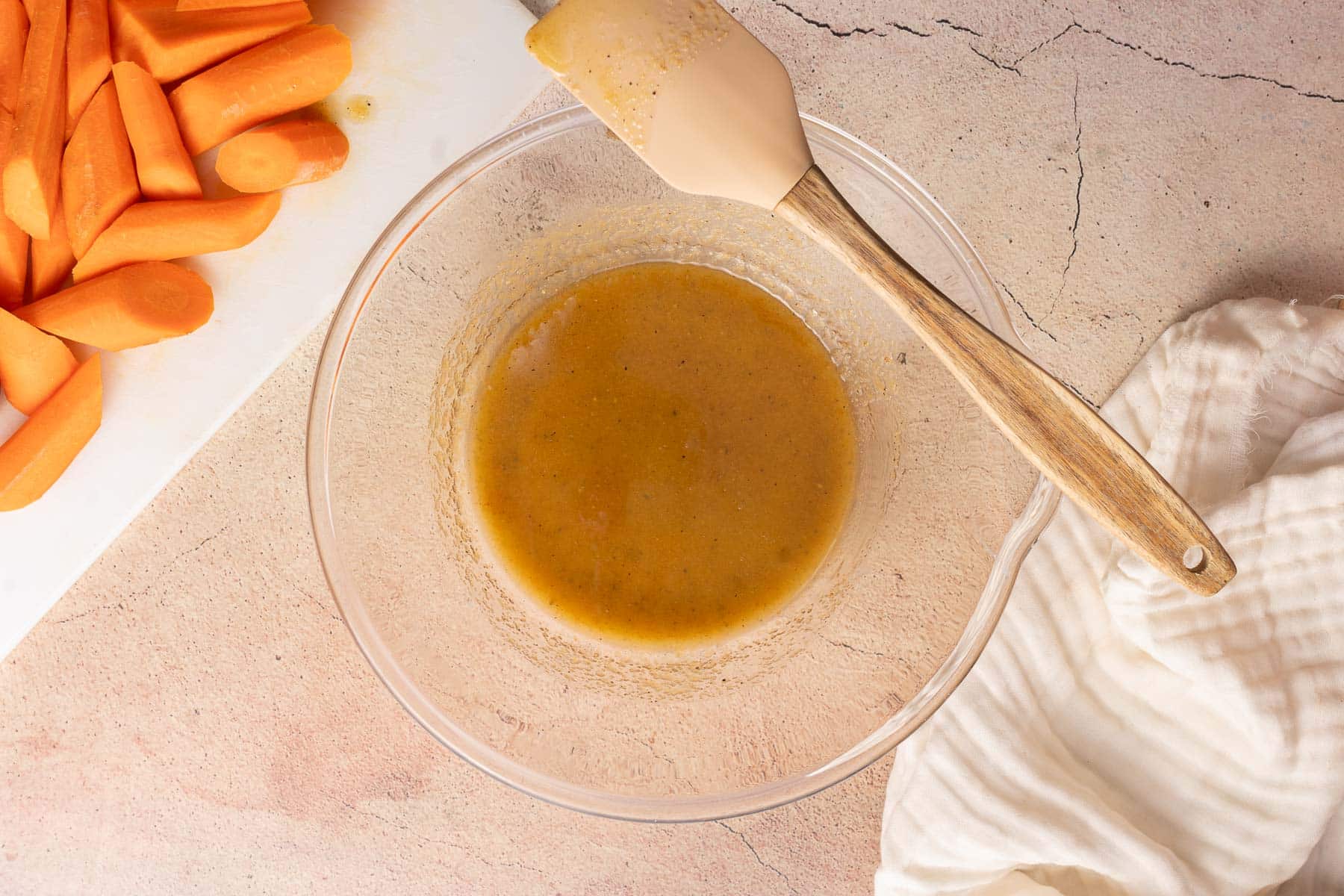 A mixture of Glazed Carrots glazed in a mixing bowl.