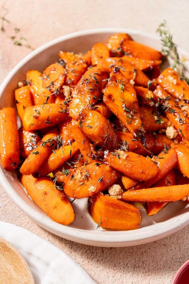 A portion of Glazed Carrots on a mixing bowl.
