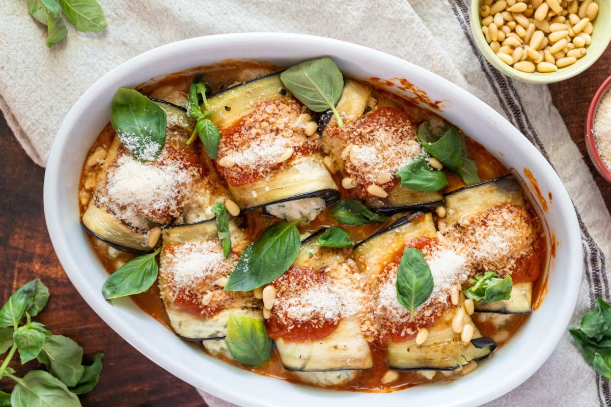 Eggplant Rollatini served on a baking dish.