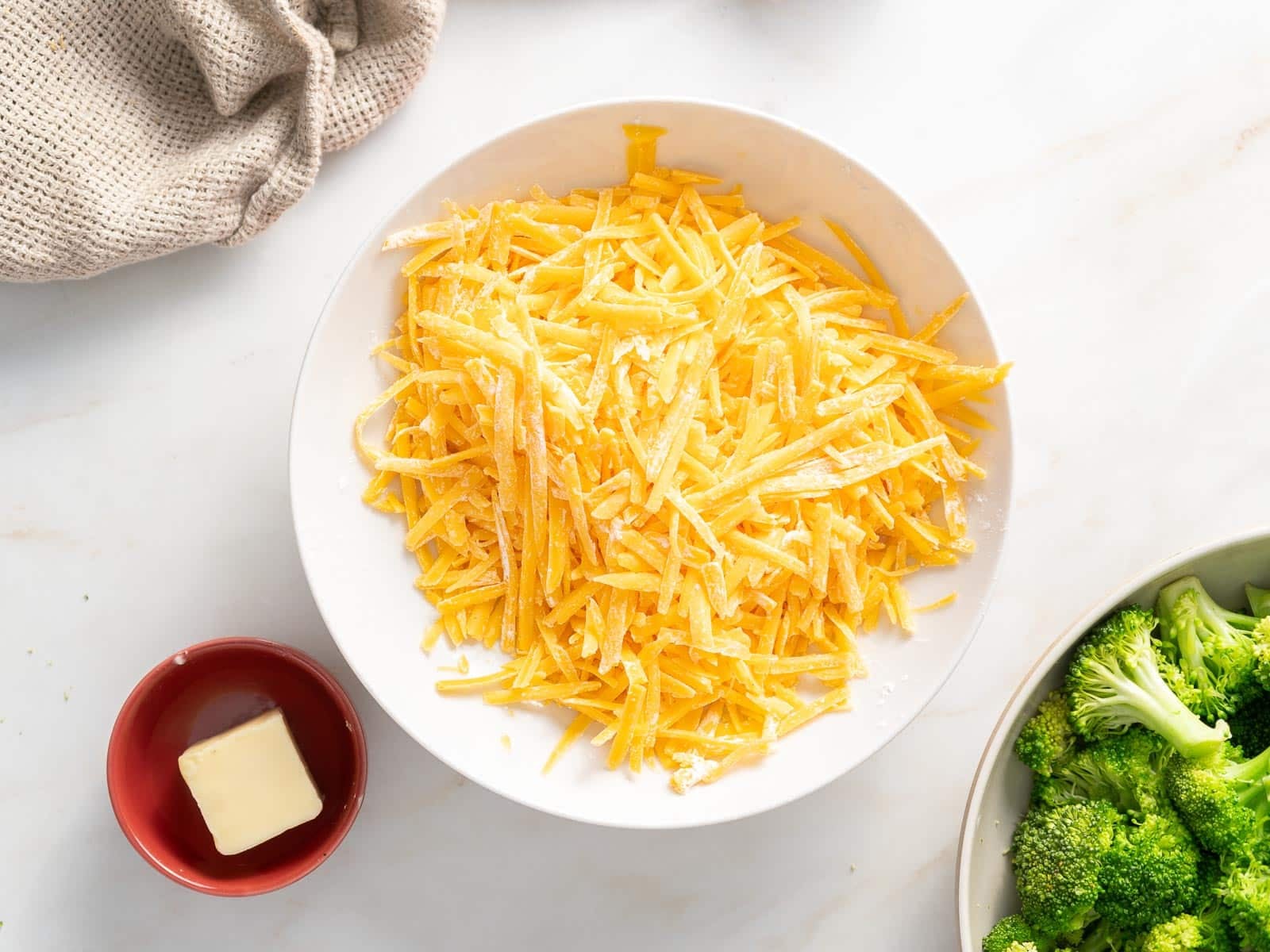 Grated cheese bar on a plate.