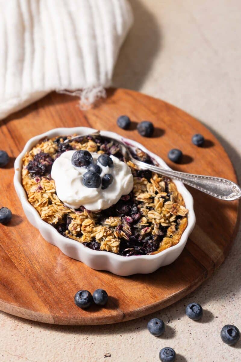 Oatmeal with blueberries topped with vanilla cream.