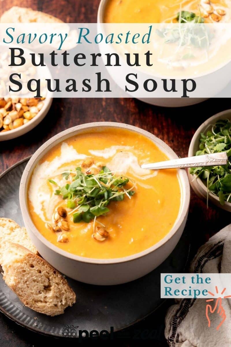 Butternut squash soup in a bowl with a swirl of cream, microgreens and a piece of toasted bread.